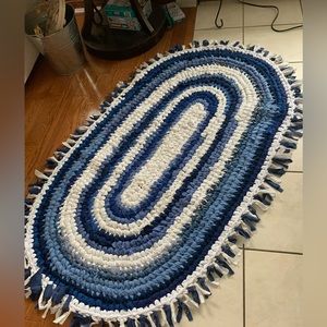 Upcycled fabric crocheted rug. Soft and cozy.